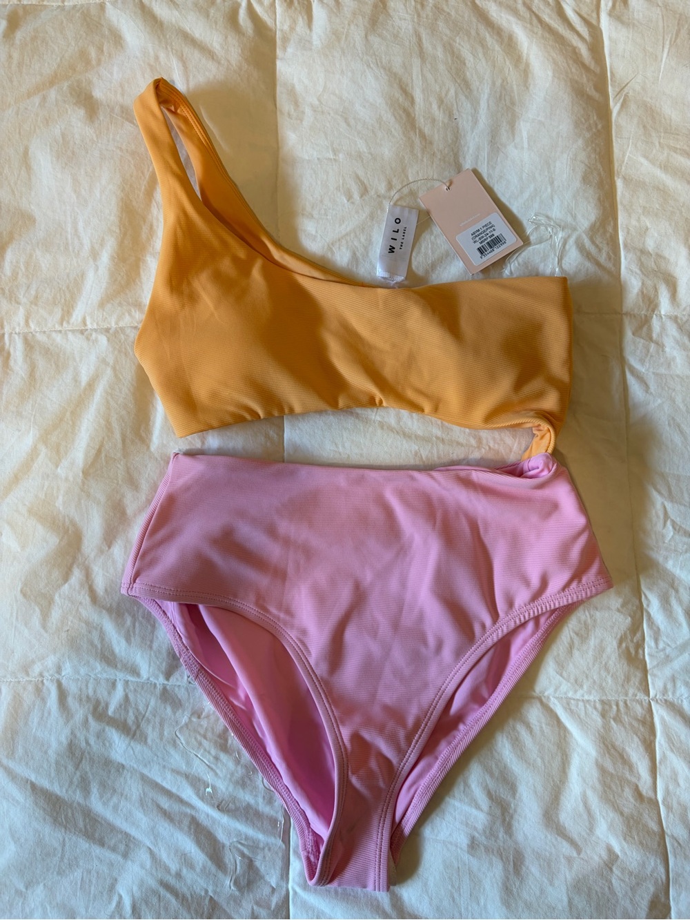 WILO THE LABEL- NWT size small asymmetrical Cutout One-Piece Swimsuit.